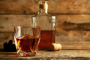 Whiskey on wooden background